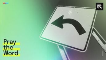 Yellow and black arrow road sign.