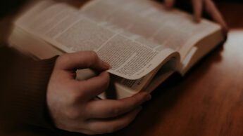 A woman reading the Bible.