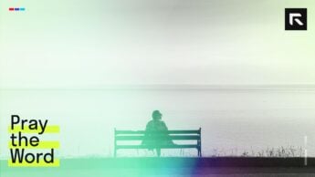 Woman sitting on a bench.