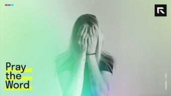 A woman covering her face in frustration.