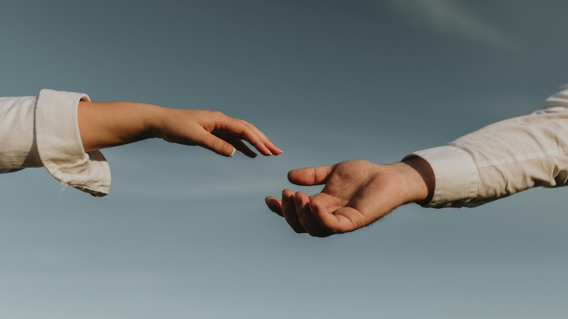 A man helping a woman.
