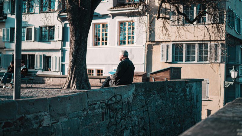 A man sitting at a park.