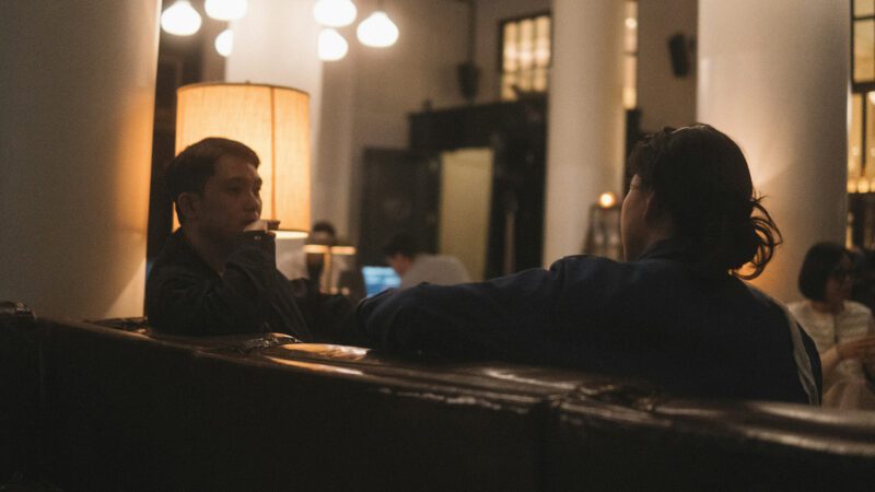Friends talking at a restaurant.