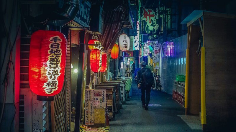 A man walking in the streets of Tokyo, Japan.