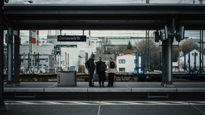 Friends at a train station.