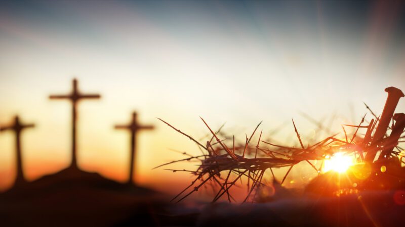 Three crosses, two nails and a crown of thorns.