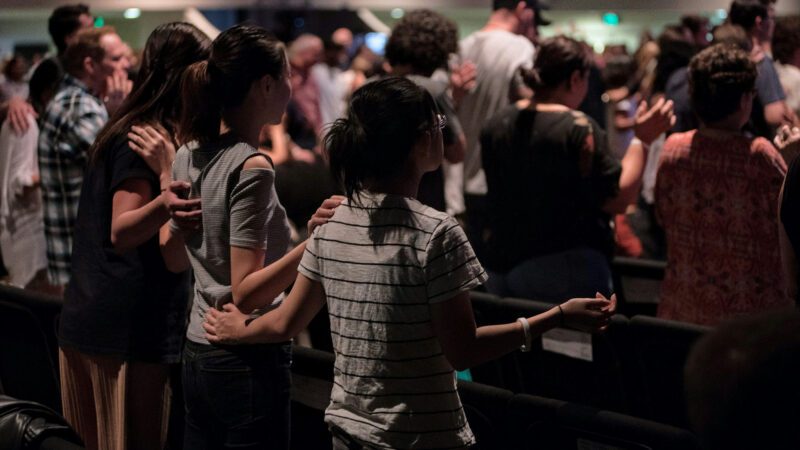 Young adults singing at church.