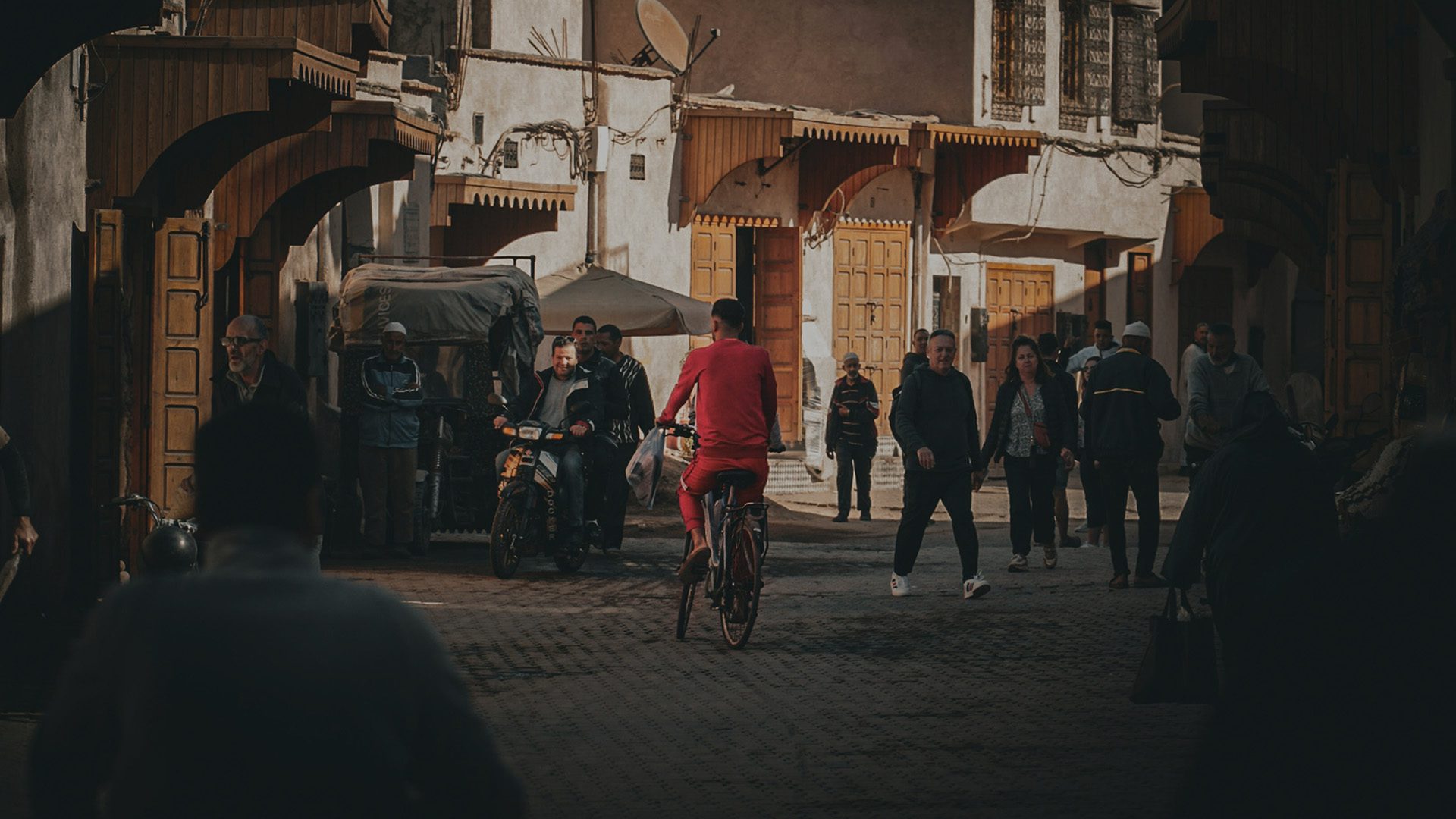 A cyclist moves through a busy street.