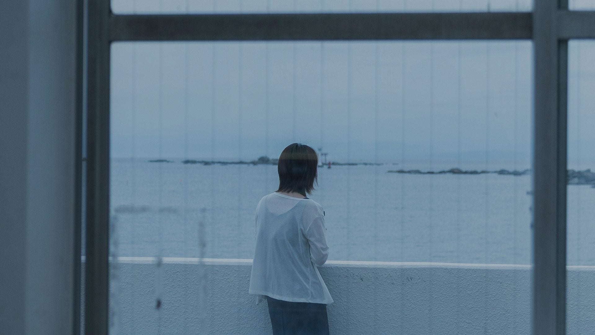 Woman looking out to sea.