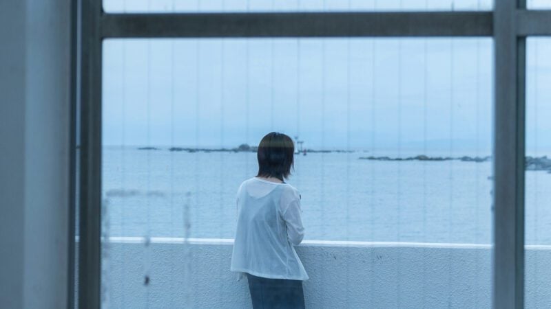 Woman looking out to sea.